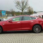 Tesla at EV charge station