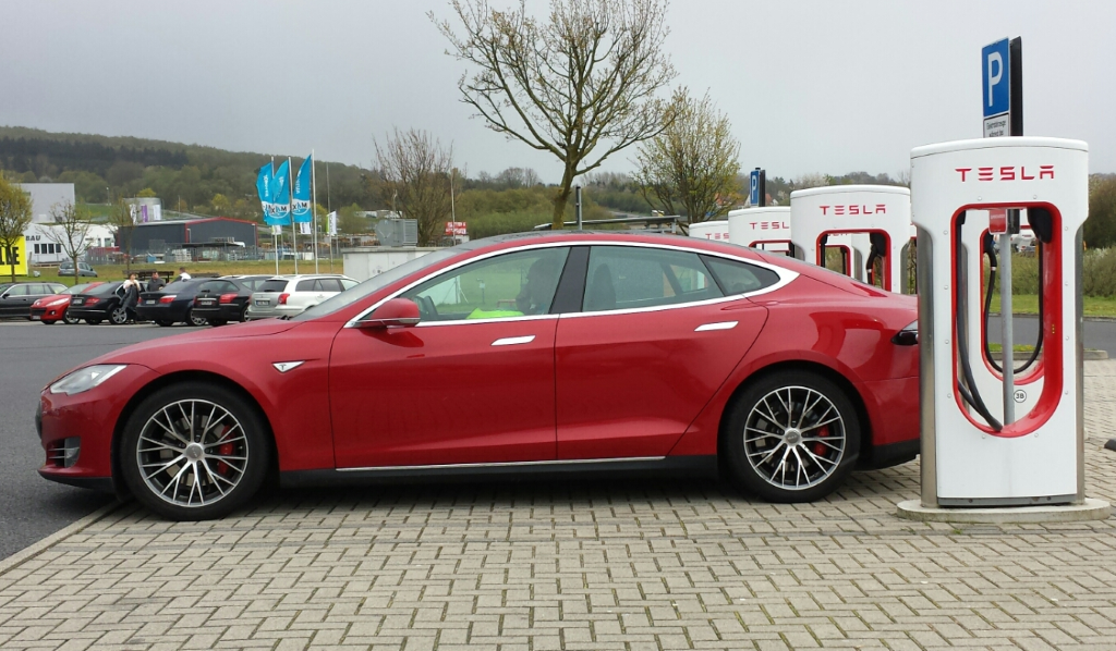 Tesla at EV charge station